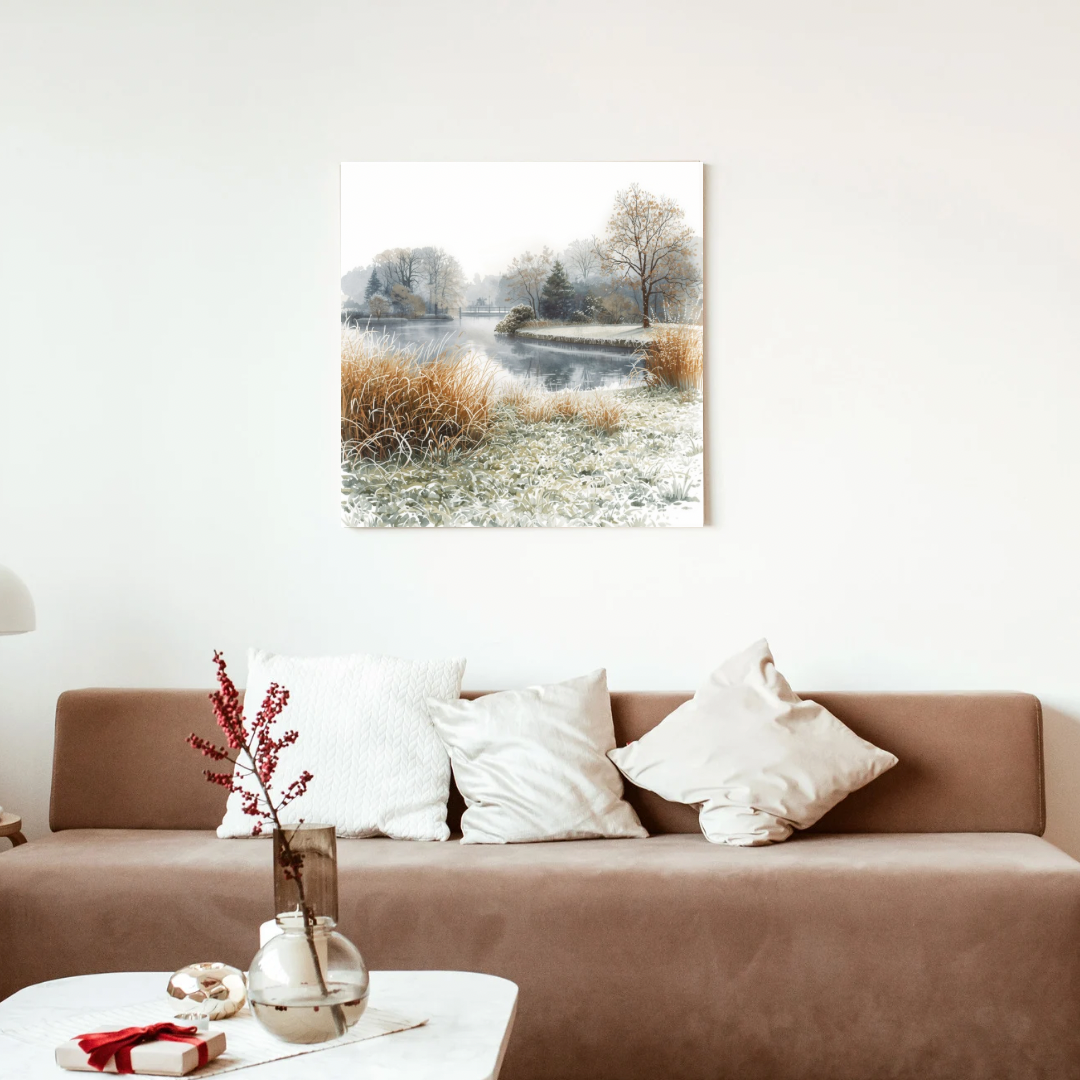 Dordrecht winterlandschap schilderij in witte lijst aan witte muur boven bruine bank met witte en roze kussens en roze takjes – aquarel wall art woonkamer

