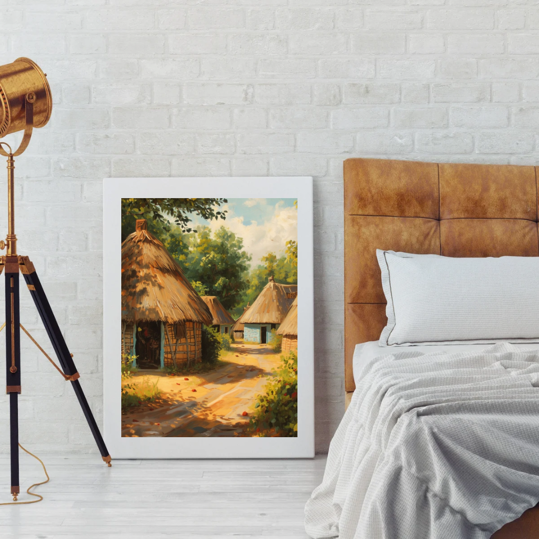 Afrikaans dorp schilderij met rieten hutten in witte lijst staand op houten vloer naast industriële vloerlamp en bed met linnen beddengoed – etnisch wall art slaapkamer
