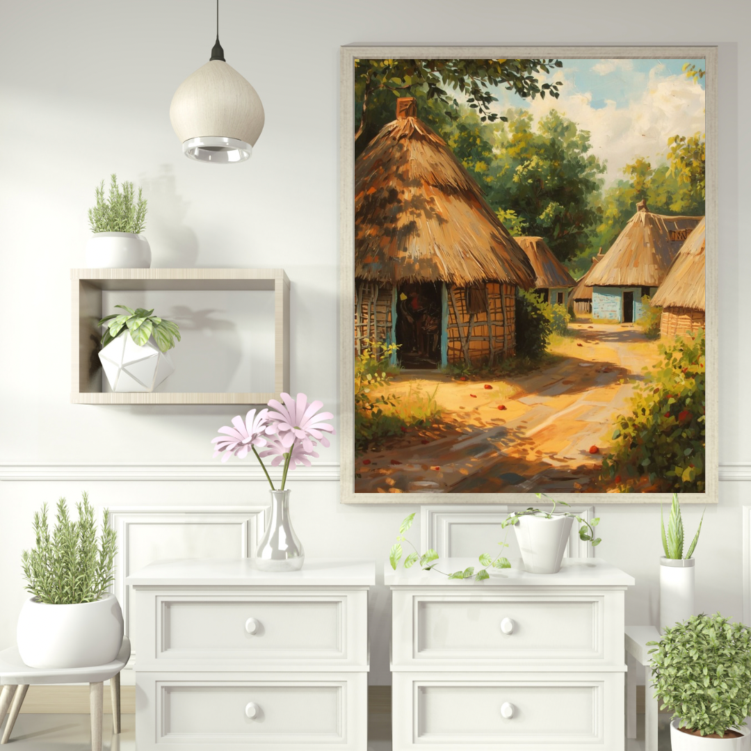 Afrikaans dorp schilderij met rieten hutten in witte lijst aan witte muur boven wit dressoir met witte hanglamp en roze bloem – etnisch wall art woonkamer
