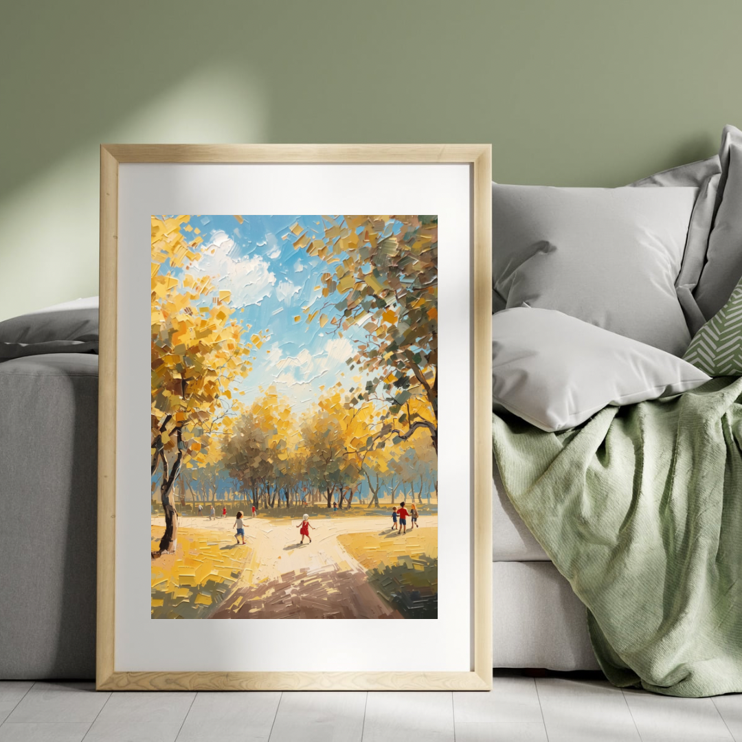 Herfstpark schilderij in witte lijst staand op houten vloer naast grijsgroene bank met mintgroene deken in woonkamer – natuur wall art print interieur
