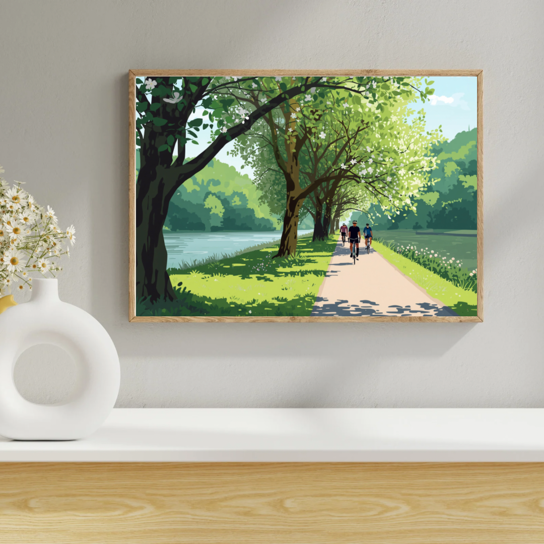 Alphen aan den Rijn lentefietspad schilderij in donkergroene lijst aan witte muur boven houten plank met witte vaas en droogbloemen in hal – wall art print
