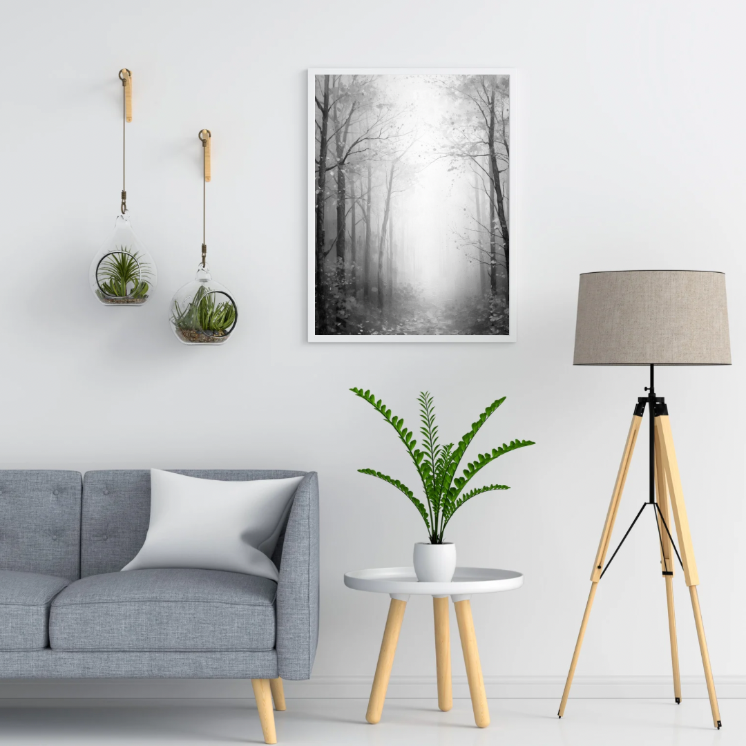Zwart-wit mistig winterbos kale bomen sneeuwvlokken schilderij in twee zwarte lijsten aan witte muur boven grijze bank met witte kussens en vloerlamp – woonkamer schilderij

