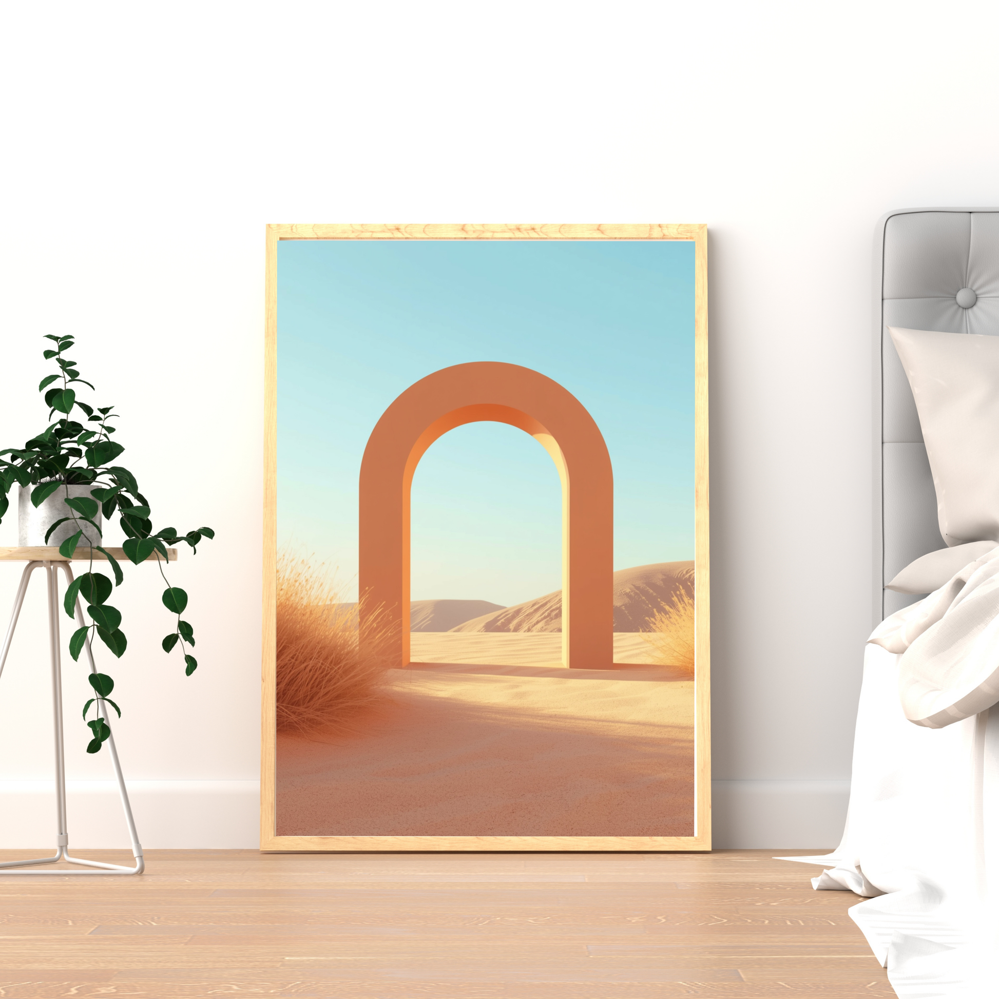 Woestijn boog canvas schilderij in gouden lijst op houten plank naast plant in logeerkamer — zandduinen wanddecoratie
